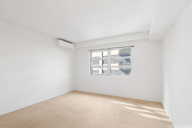 carpeted empty room featuring a textured ceiling and a wall mounted air conditioner