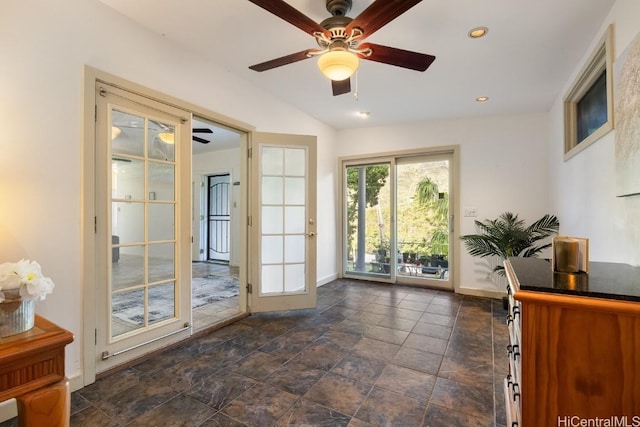 entryway with ceiling fan and lofted ceiling