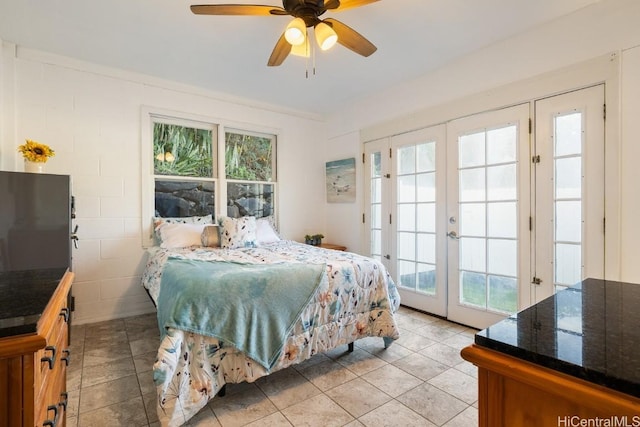 bedroom featuring access to outside, french doors, and ceiling fan