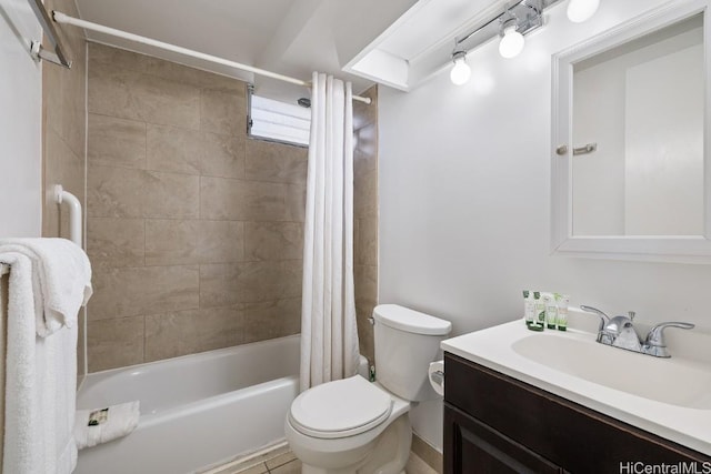 full bathroom with shower / tub combo, vanity, and toilet