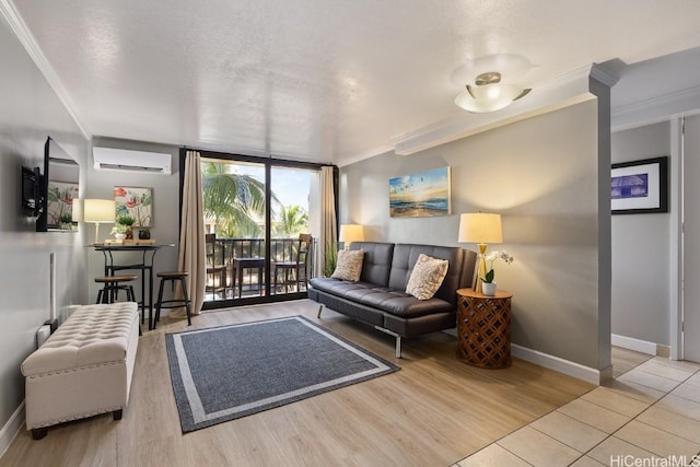 living room featuring a textured ceiling, a wall unit AC, light hardwood / wood-style floors, and crown molding