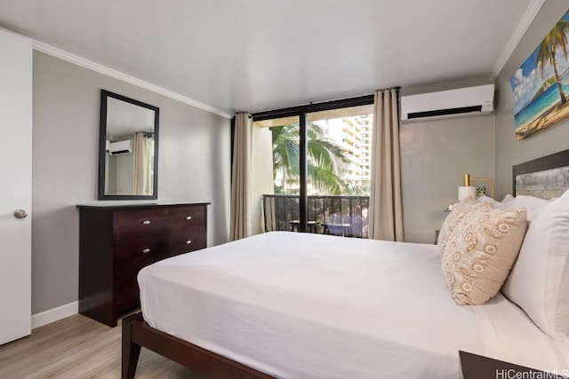 bedroom with a wall mounted AC, ornamental molding, access to exterior, floor to ceiling windows, and light hardwood / wood-style flooring