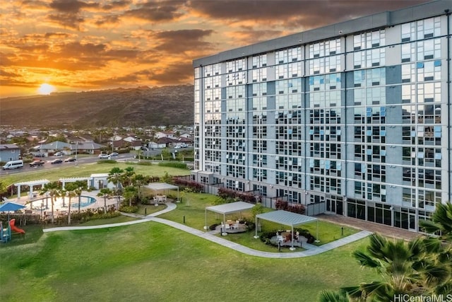 view of outdoor building at dusk