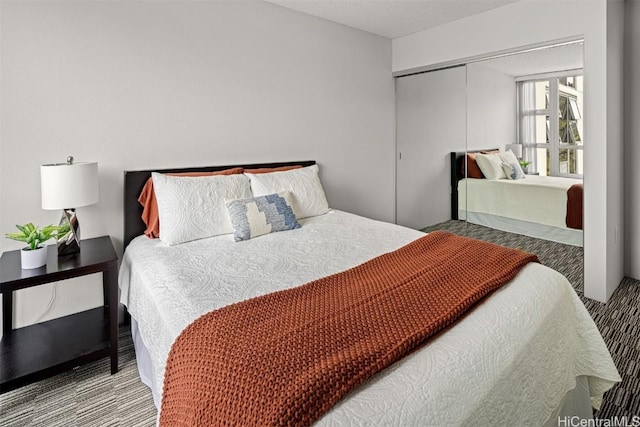 carpeted bedroom featuring a closet