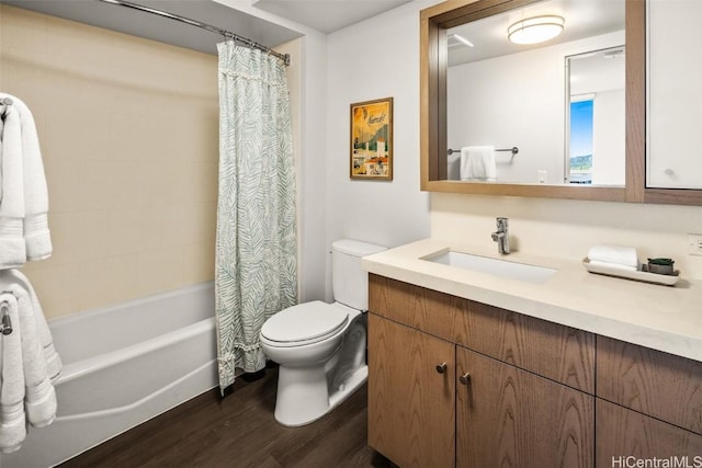 full bathroom featuring toilet, vanity, shower / tub combo, and wood finished floors