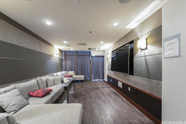 cinema room with hardwood / wood-style floors