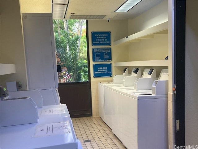 laundry area with washing machine and clothes dryer