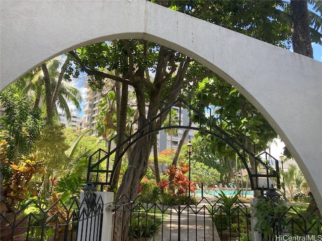 view of gate featuring a community pool