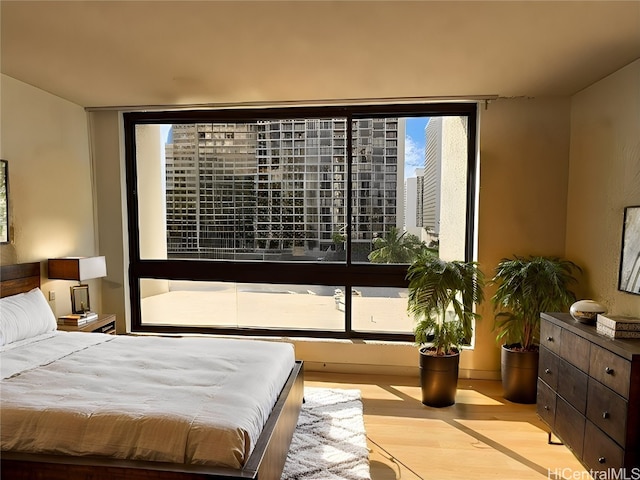 bedroom with light hardwood / wood-style flooring