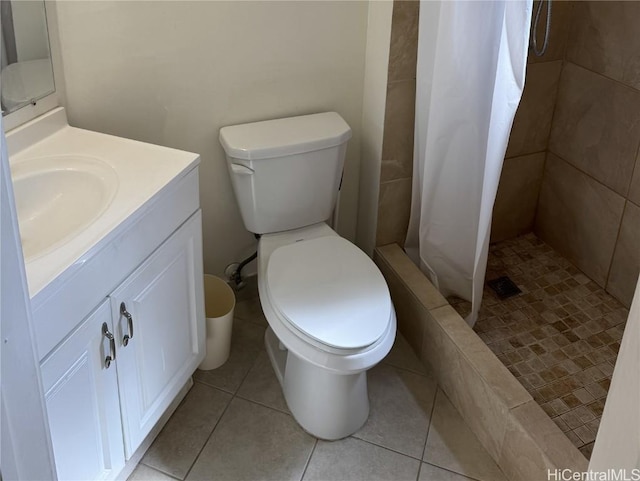 bathroom featuring tile patterned floors, vanity, toilet, and a shower with shower curtain