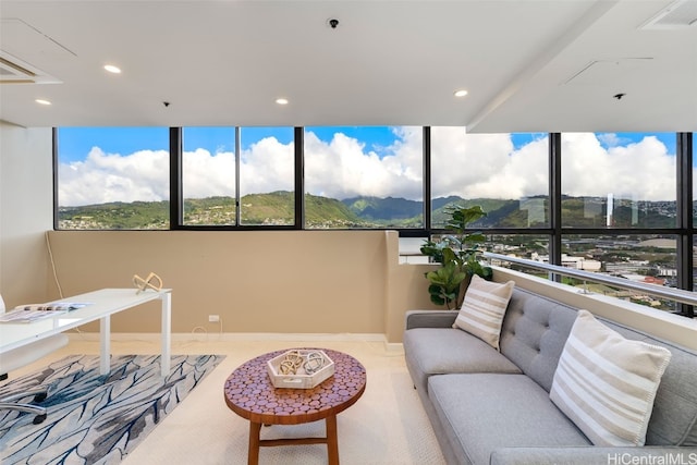 sunroom / solarium with a mountain view and plenty of natural light