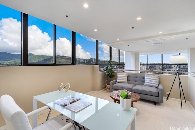 sunroom / solarium with a mountain view