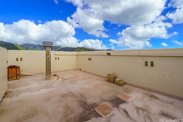 view of patio / terrace featuring a mountain view