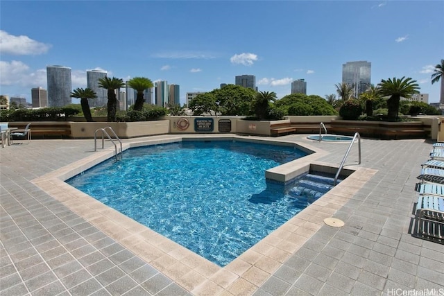 view of swimming pool with a patio area