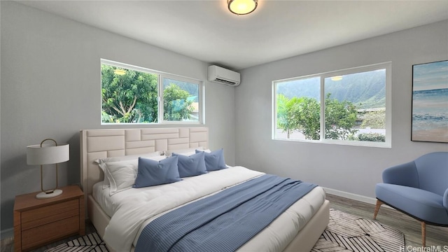 bedroom with hardwood / wood-style flooring, a wall unit AC, and multiple windows