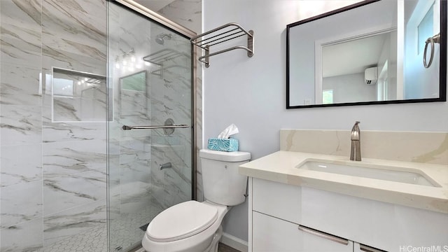 bathroom with vanity, toilet, and a shower with door