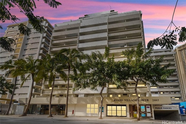 view of outdoor building at dusk