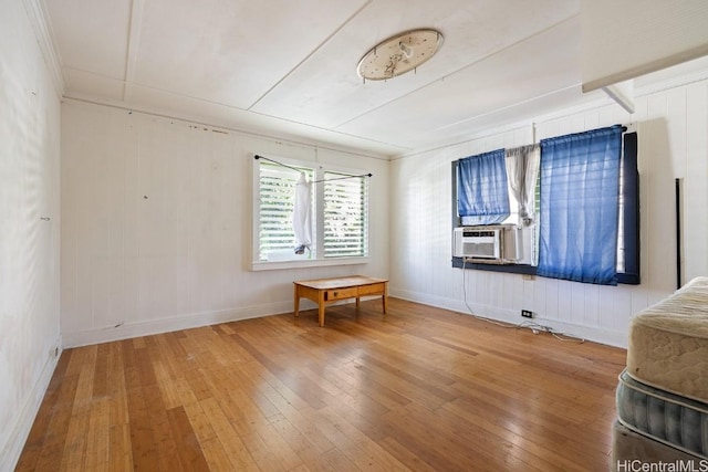 unfurnished room with hardwood / wood-style floors and cooling unit