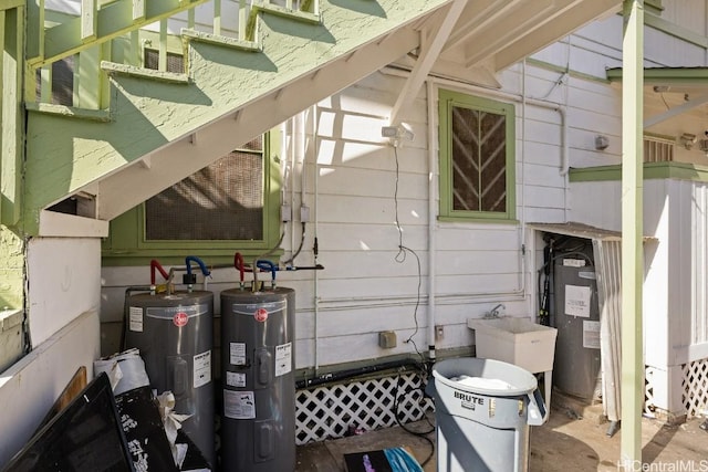 exterior space featuring electric water heater and sink