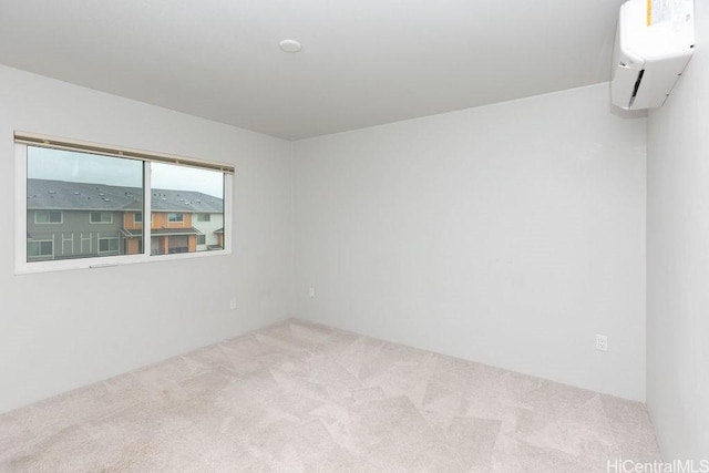 spare room with carpet flooring and an AC wall unit