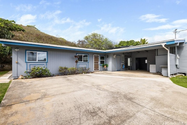 ranch-style house with a carport