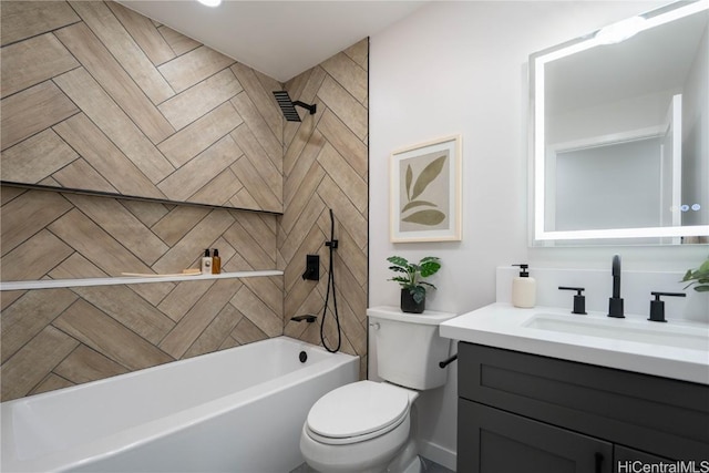 full bathroom featuring vanity, toilet, and tiled shower / bath