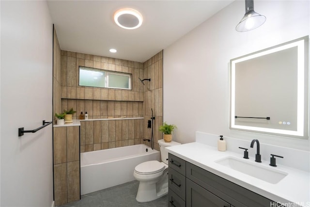 full bathroom with tile patterned floors, vanity, toilet, and tiled shower / bath