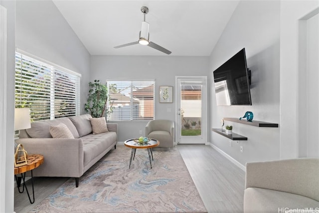 living room featuring light hardwood / wood-style floors and ceiling fan