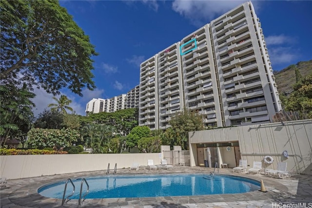 view of swimming pool with a patio