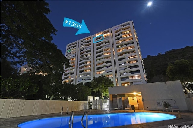 view of pool at night