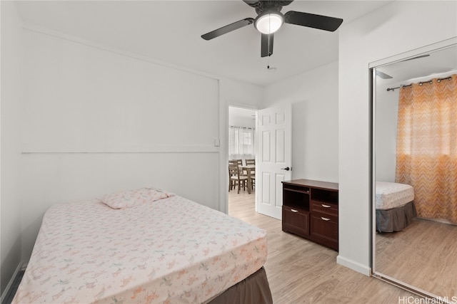 bedroom featuring ceiling fan and light hardwood / wood-style flooring