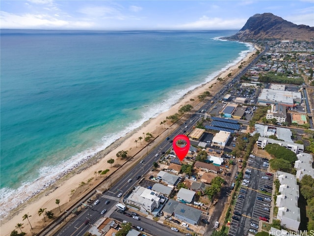 aerial view featuring a view of the beach and a water view