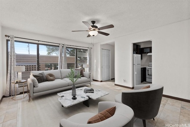 tiled living room featuring ceiling fan, a textured ceiling, and a baseboard heating unit