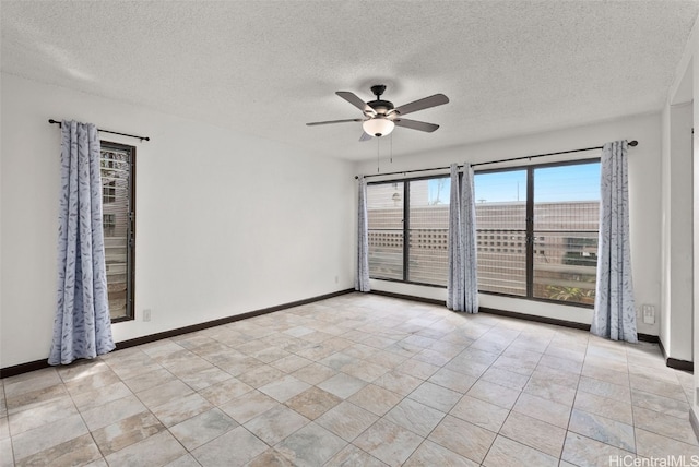 unfurnished room featuring ceiling fan, a textured ceiling, and a wealth of natural light