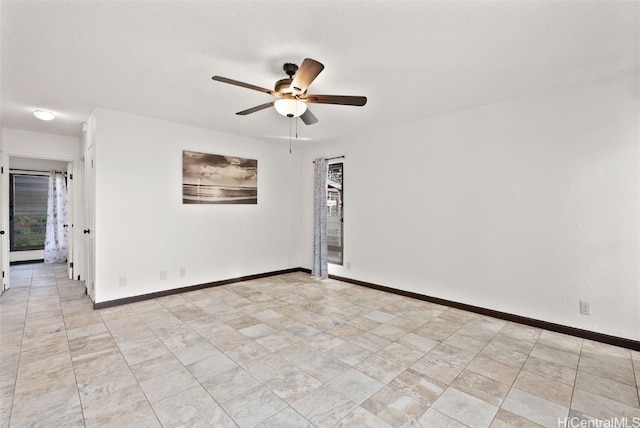 unfurnished room featuring a textured ceiling and ceiling fan