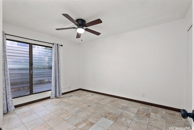 spare room with ceiling fan, plenty of natural light, and a textured ceiling