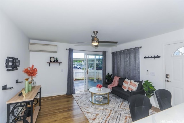 living room featuring a wall mounted air conditioner, ceiling fan, and dark wood-type flooring