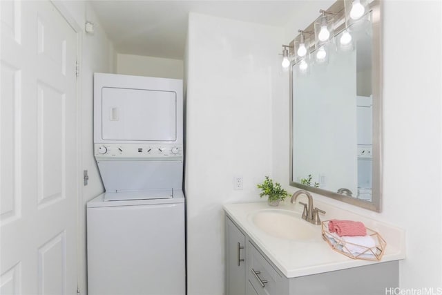 bathroom featuring vanity and stacked washer / drying machine