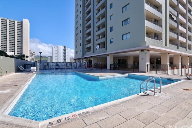 view of swimming pool with a patio