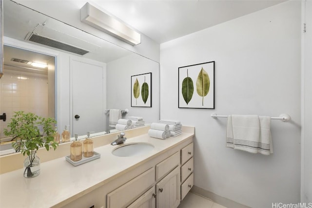 bathroom featuring tile patterned flooring and vanity