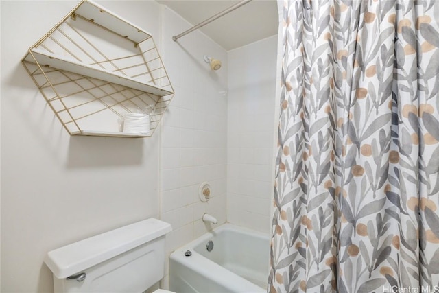 bathroom with shower / bath combination with curtain and toilet