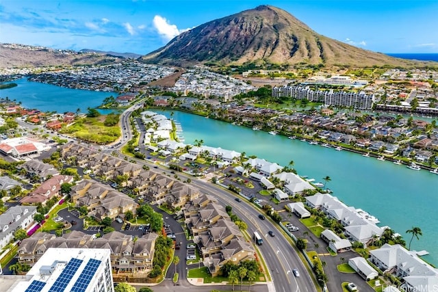 aerial view featuring a water and mountain view