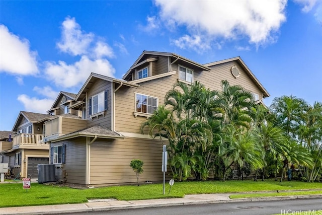 view of property exterior featuring a yard and central air condition unit