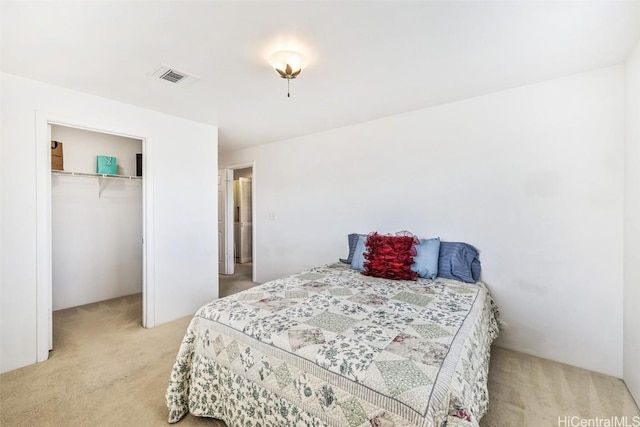 carpeted bedroom with a closet