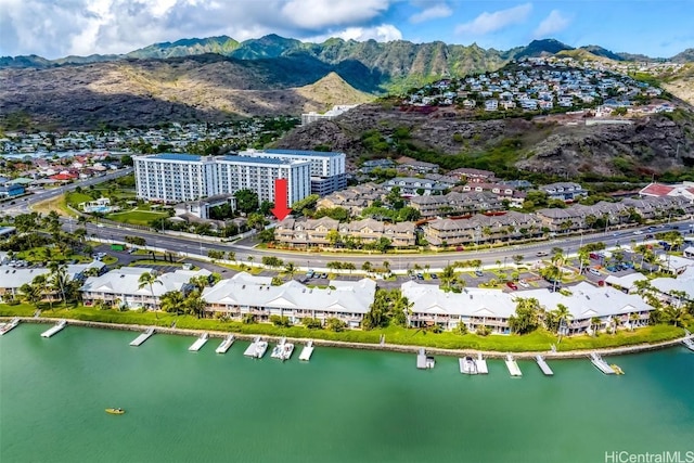 birds eye view of property featuring a water and mountain view