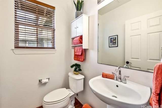 bathroom with toilet and sink