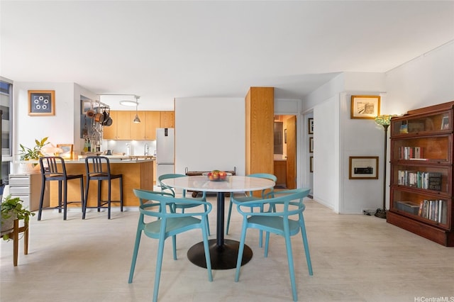 419A Atkinson Dr Unit 208, Honolulu, HI 96814 - dining area featuring light wood-style flooring
