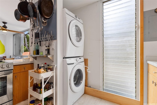 419A Atkinson Dr Unit 208, Honolulu, HI 96814 - laundry area with stacked washer / dryer, electric panel, and a ceiling fan