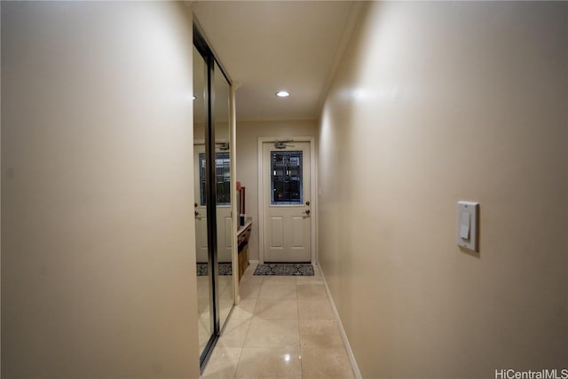 hallway featuring light tile patterned floors