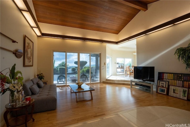 tiled living room with beam ceiling, high vaulted ceiling, and wood ceiling